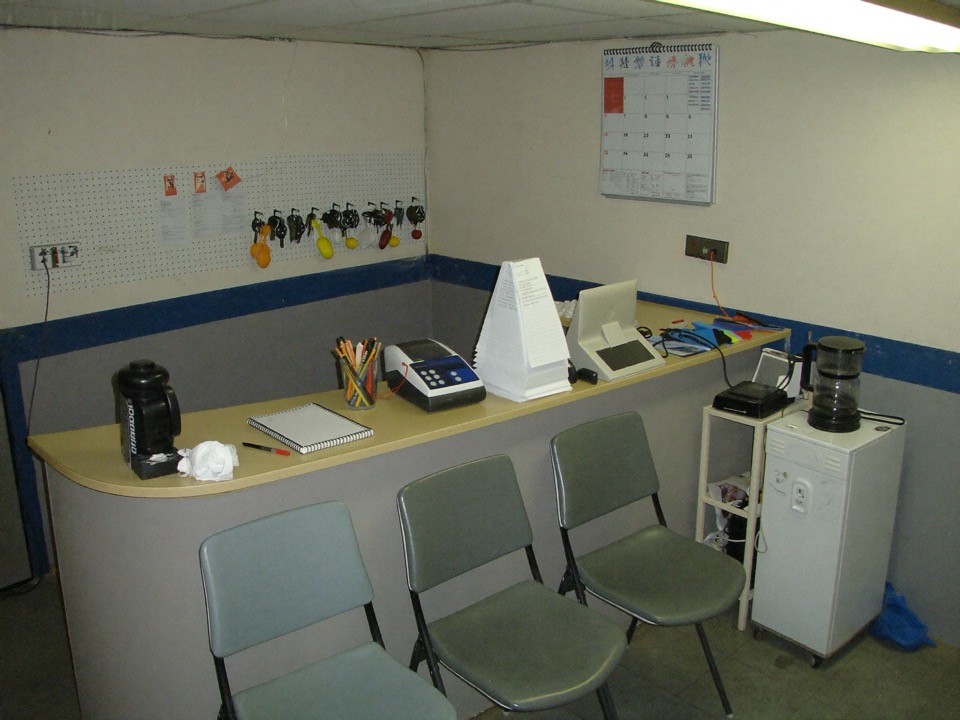 The shop's front counter with keys on numbered tags.